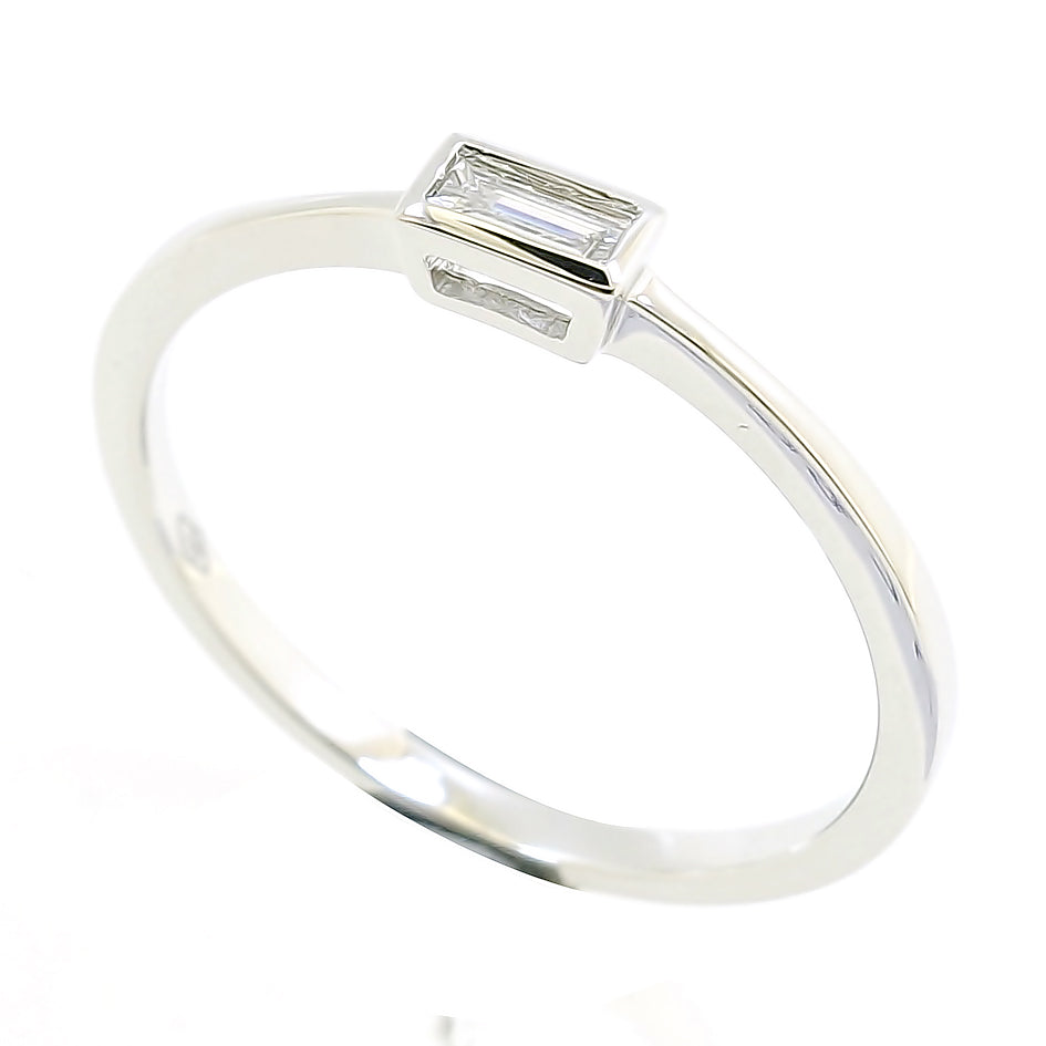 Lady's 18 Karat White Gold 0.14ct Solitaire Diamond Contemporary Fashion Ring - Size 7