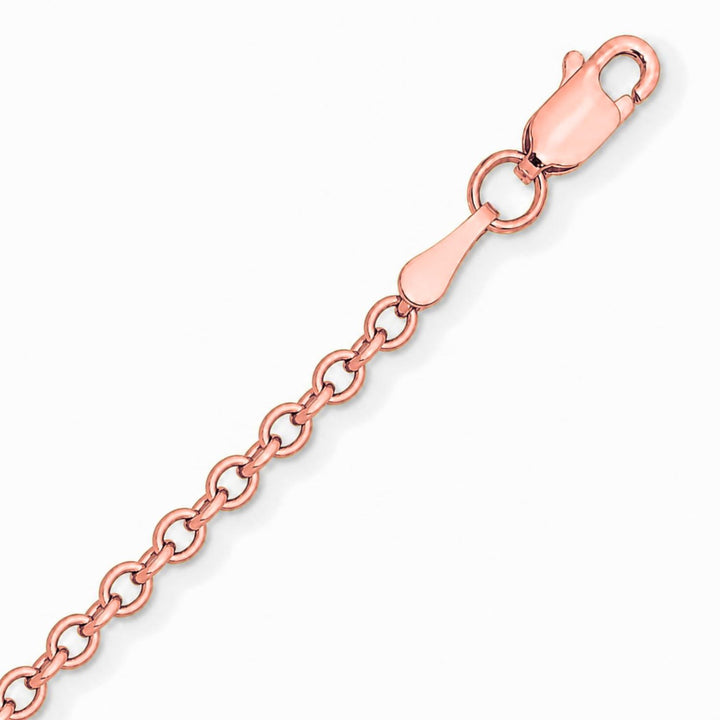 A image showing a close up of a rose gold cable chain on a white background