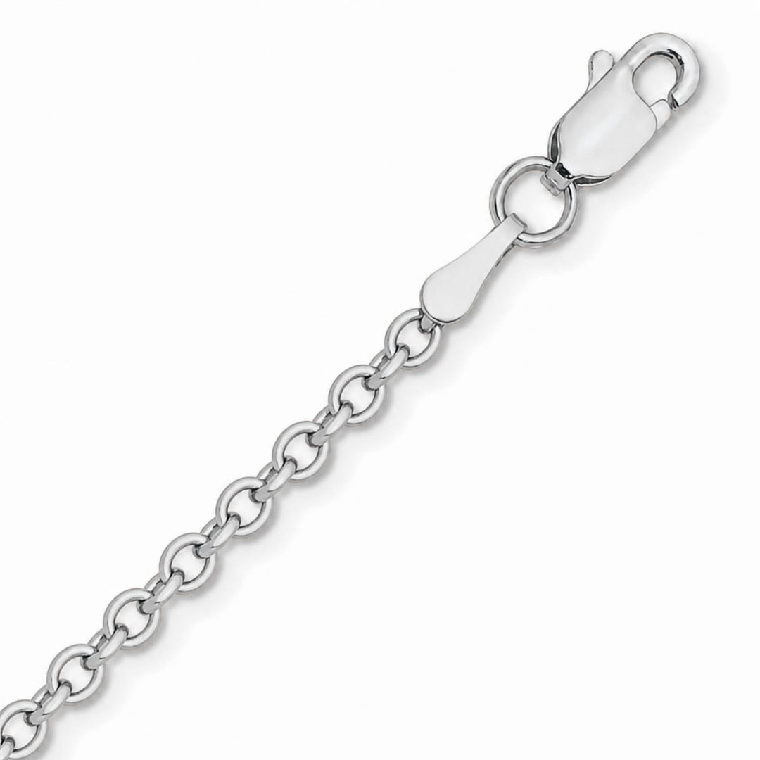 A image showing a close up of a yellow gold cable chain on a white background