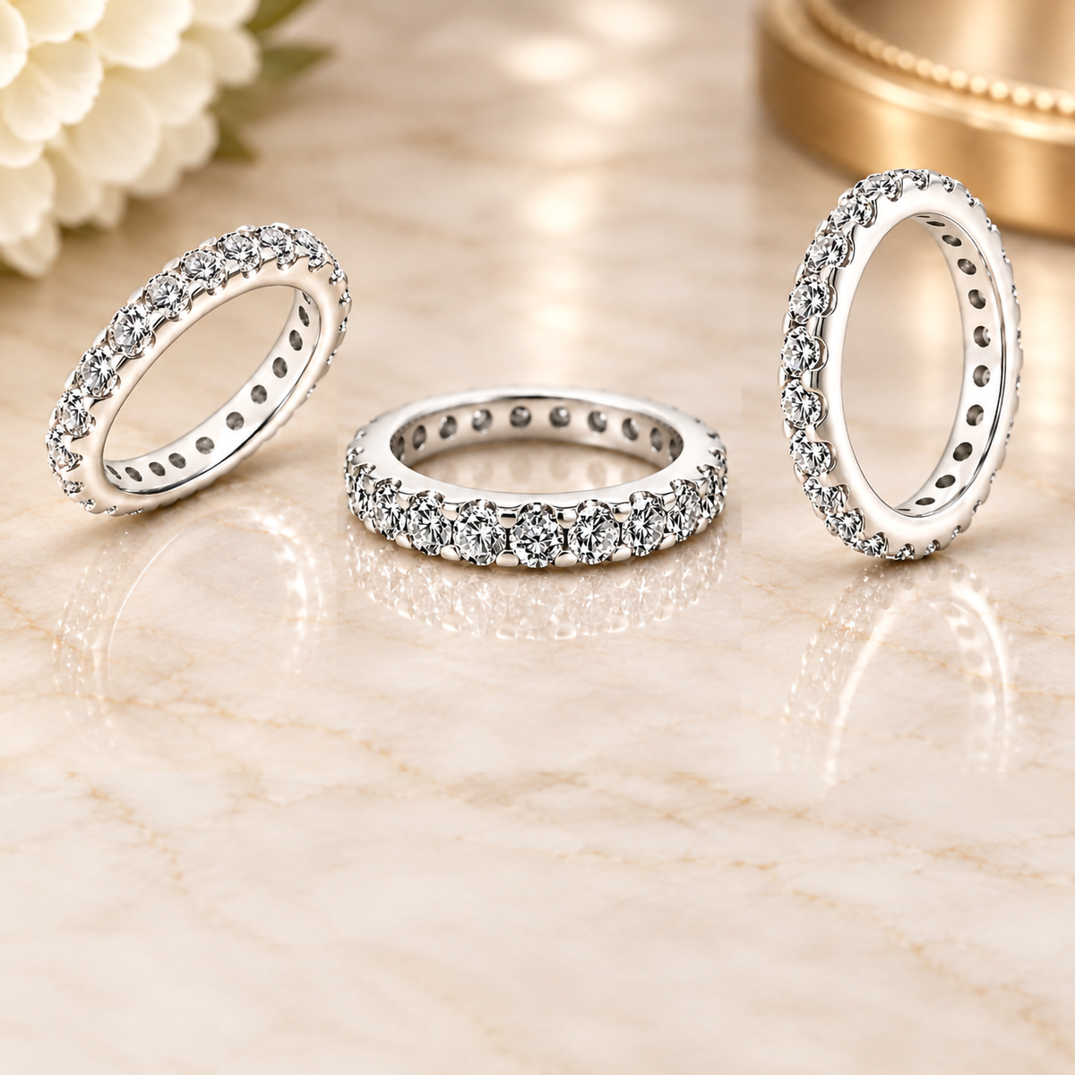 Styled photograph of the 14 karat white gold natural diamond eternity band with all angles standing on marble at AJ's Jewelry