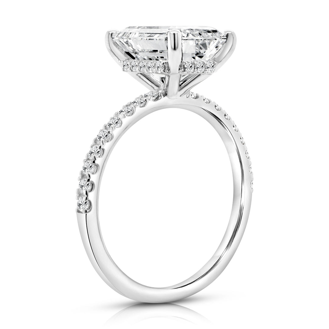 14 karat white gold 3.5ct emerald cut lab-grown diamond hidden halo engagement ring, side profile view showing the hidden halo and pave band