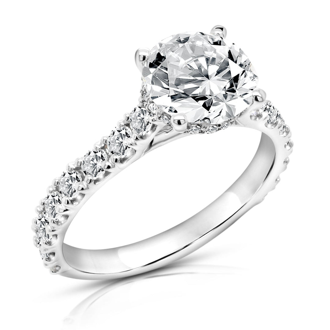 14 karat white gold 3ct round lab grown diamond hidden halo engagement ring with diamond accent band, angled three-quarter view
