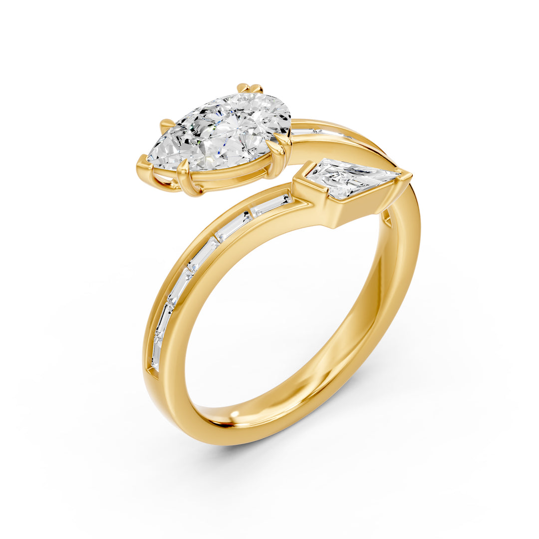 14K yellow gold bypass ring with pear lab-grown diamond and baguette accents