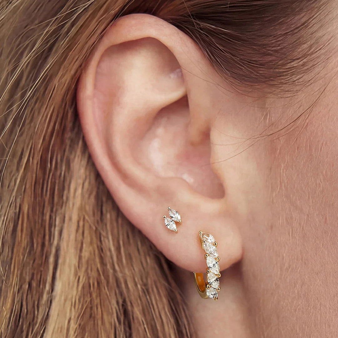Styled ear look featuring the 14K yellow gold double marquise lab grown diamond stud earrings | AJ's Jewelry