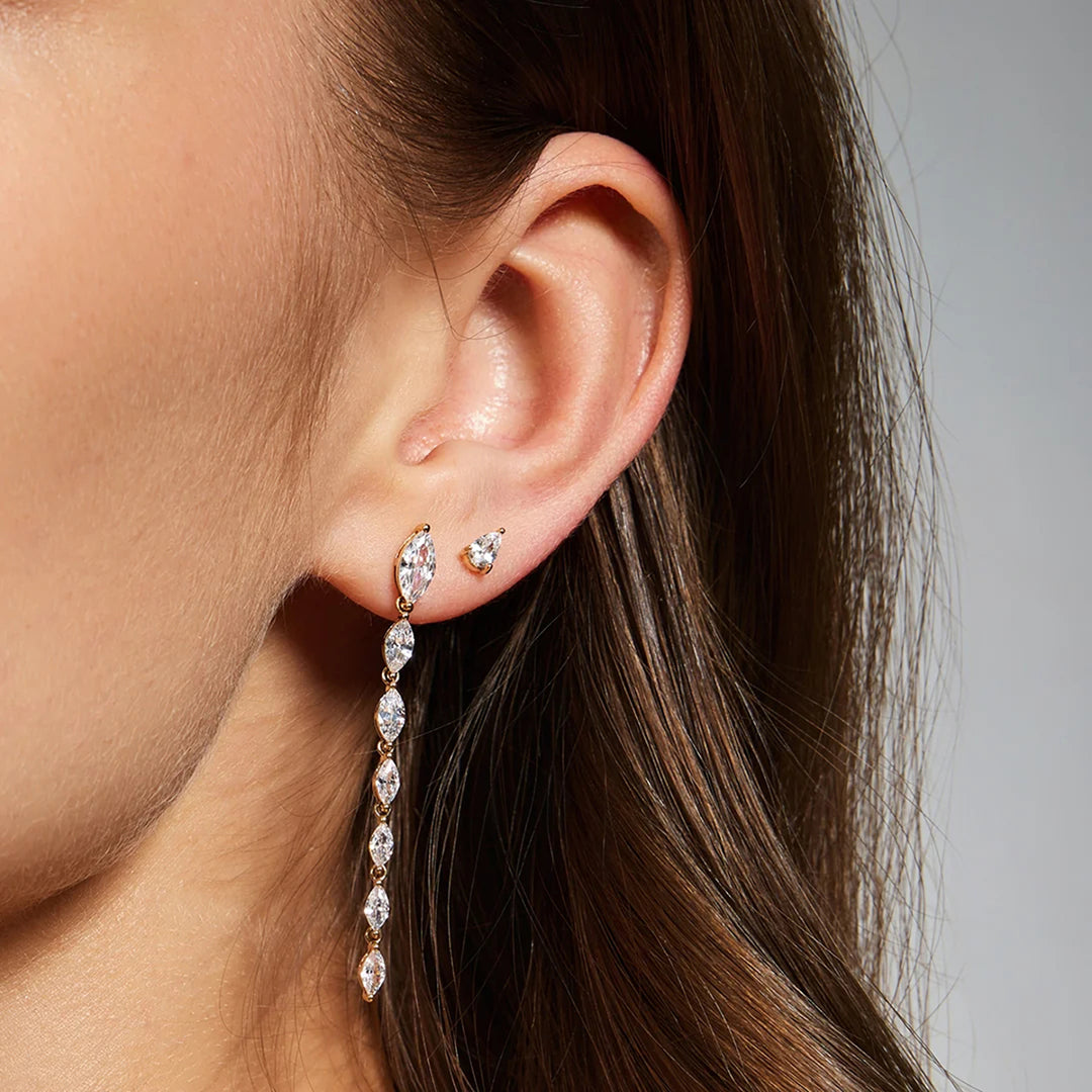 The 14K yellow gold pear lab grown diamond stud earrings shown on a model in profile | AJ's Jewelry
