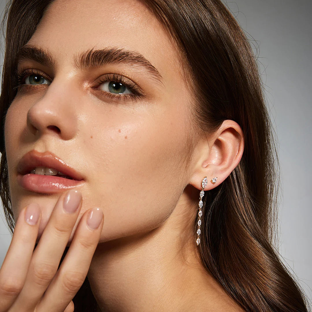Ear stack featuring the 14K yellow gold pear lab grown diamond stud earrings | AJ's Jewelry