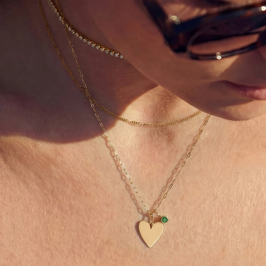 Model wearing the 14K yellow gold polished heart pendant necklace, close-up | AJ's Jewelry