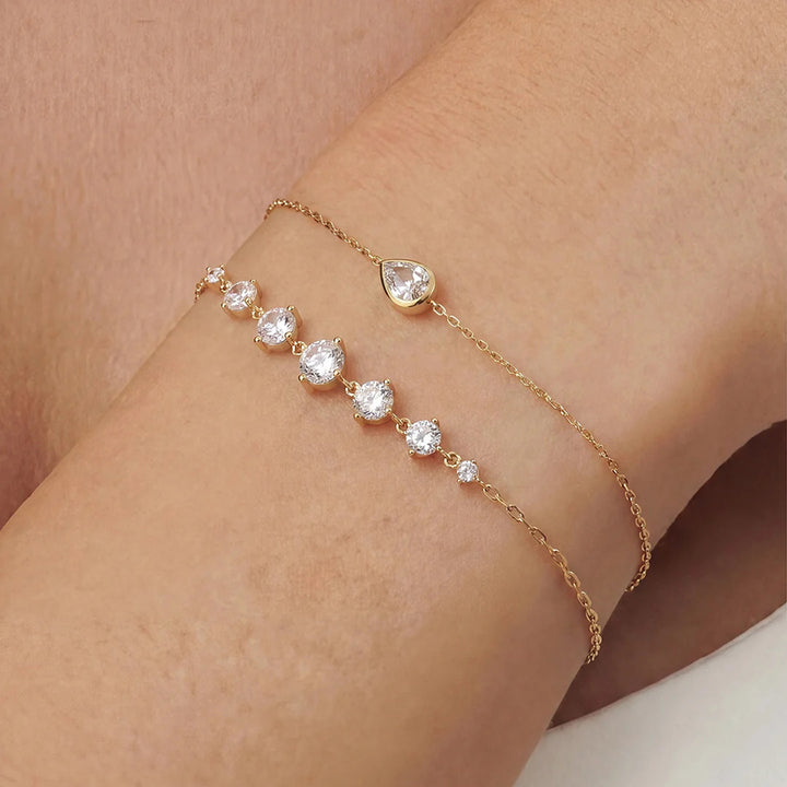 Close-up of the 14K yellow gold round lab grown diamond graduated line bracelet worn on the wrist | AJ's Jewelry