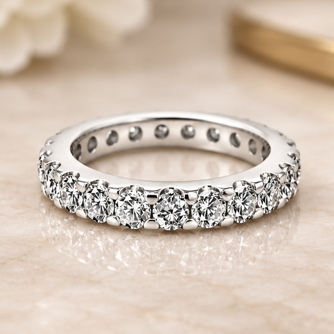 Styled front photograph of the 14 karat white gold 1.5ct natural diamond eternity band with its diamonds facing up