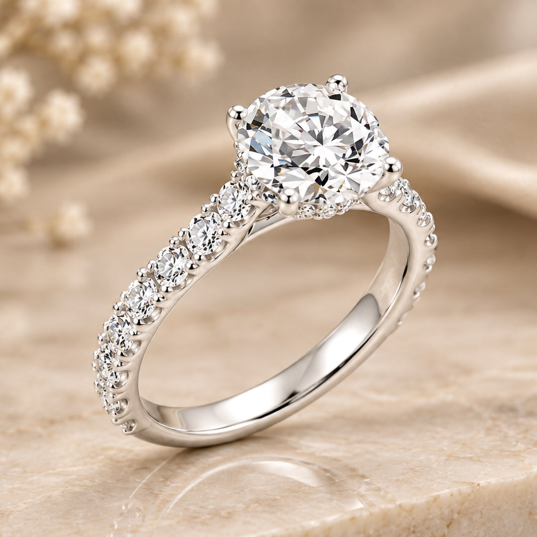 Angled view of the 3ct round lab grown diamond hidden halo engagement ring in 14 karat white gold with a diamond band