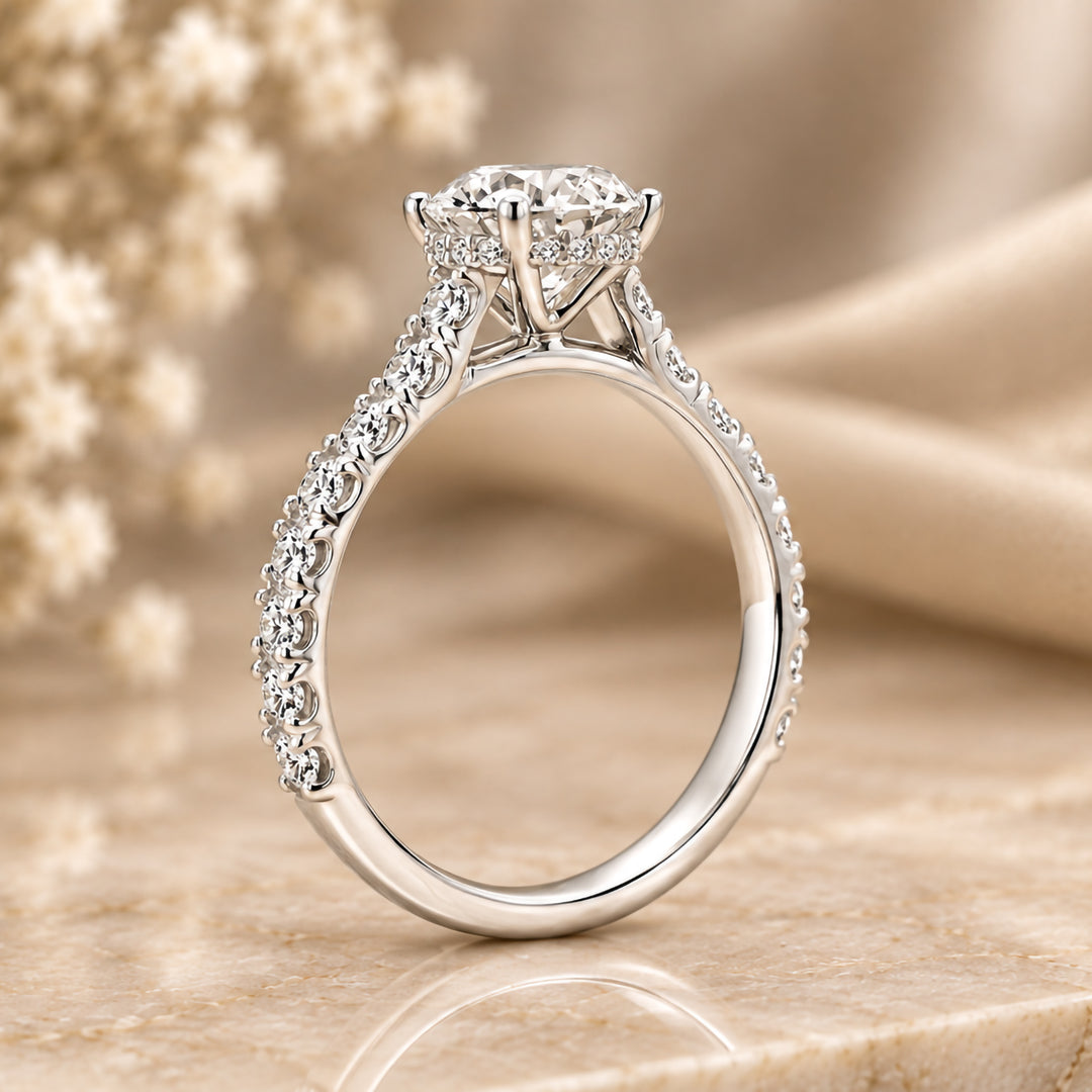 Side profile of the 14 karat white gold round lab grown diamond engagement ring showing the hidden halo beneath the center stone