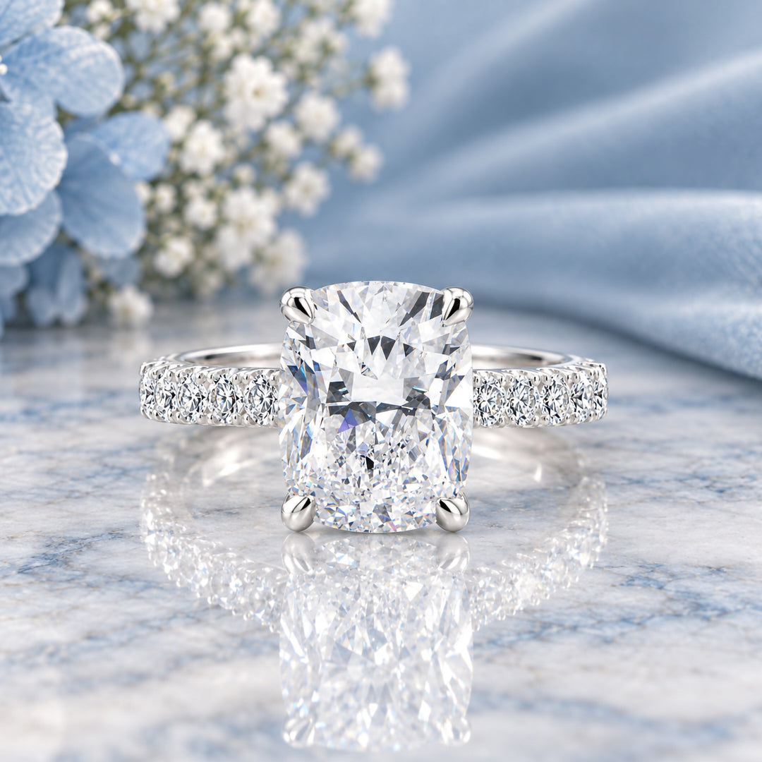 Front view of the 14 karat white gold elongated cushion lab grown diamond engagement ring reading as a clean solitaire from above