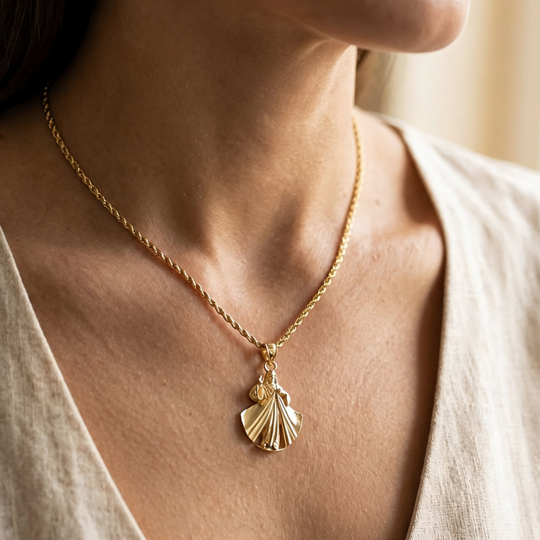 Custom 14KT yellow gold Divine Mercy shell pendant on a rope chain worn on a neck at AJ's Jewelry in Ridgewood, Queens NY