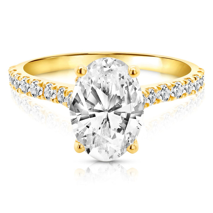 18 karat yellow gold 2ct oval lab grown diamond hidden halo engagement ring with diamond accent band, front view