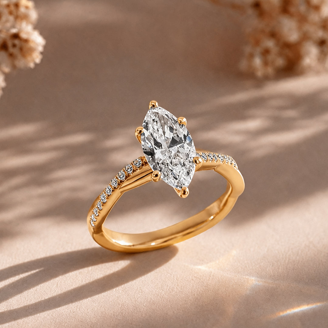 18k yellow gold marquise twist lab grown diamond engagement ring at an angle, AJ's Jewelry Queens NY