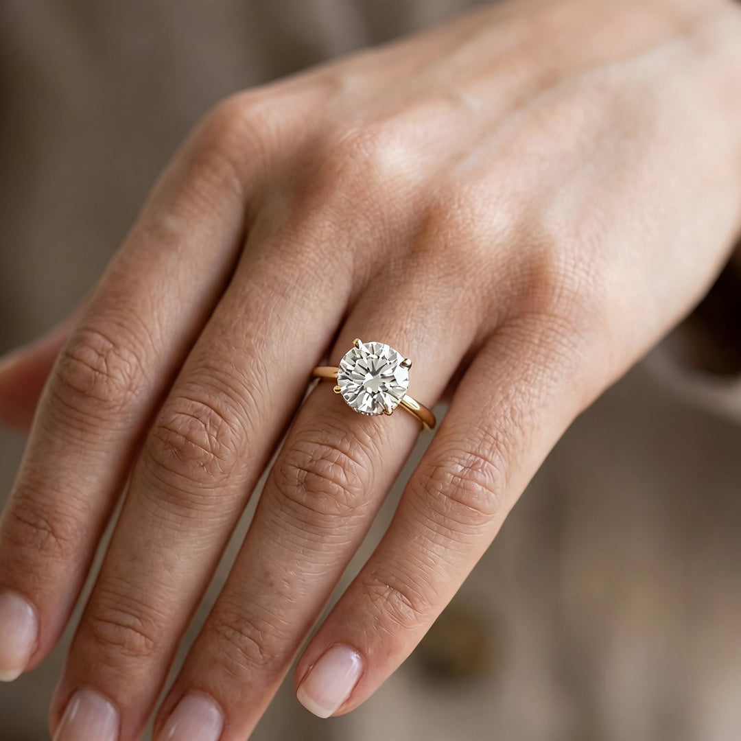 2 carat round hidden halo lab grown diamond engagement ring worn on a hand at AJ's Jewelry in Ridgewood, Queens NY