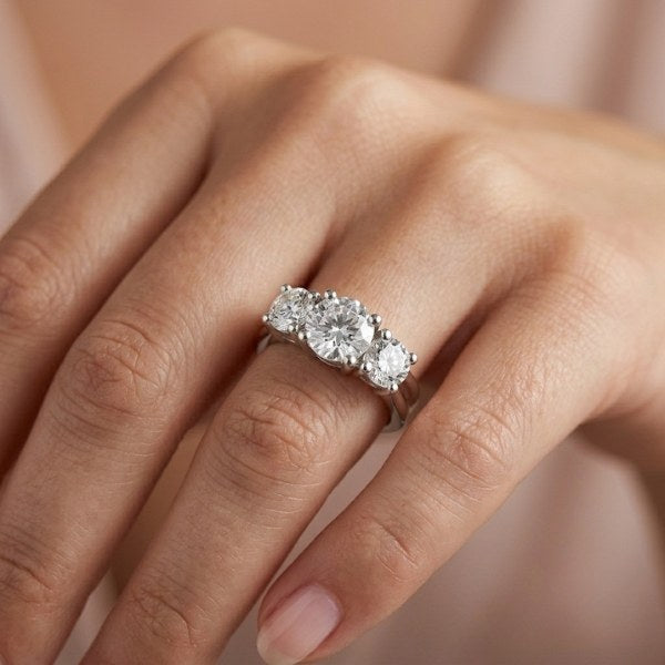 Lifestyle shot of the completed 3-stone lab grown diamond anniversary ring at AJ's Jewelry — custom birthday ring in Ridgewood Queens NY