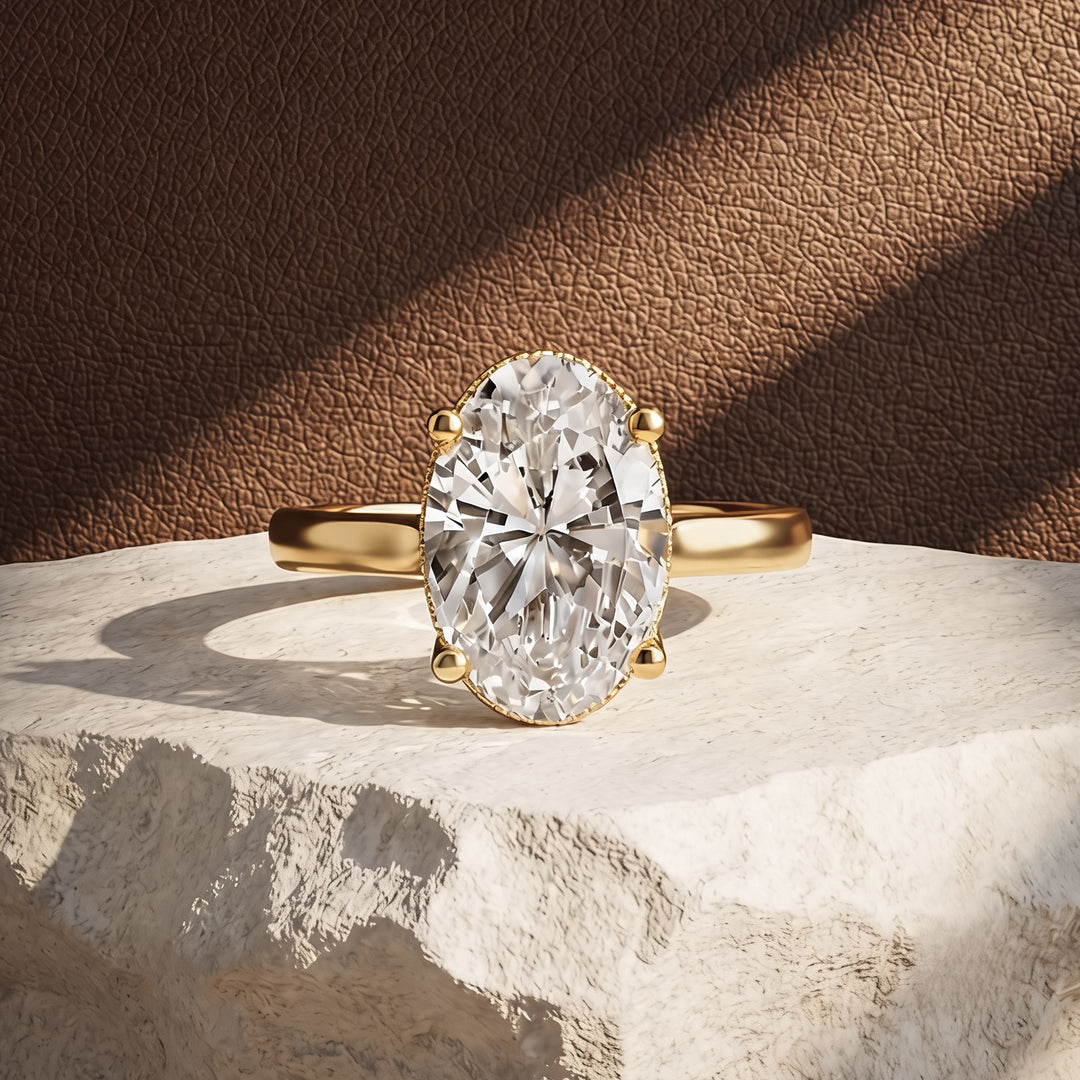 3ct oval lab grown diamond solitaire engagement ring with milgrain halo, front angle on a styled display - AJ's Jewelry Queens NY