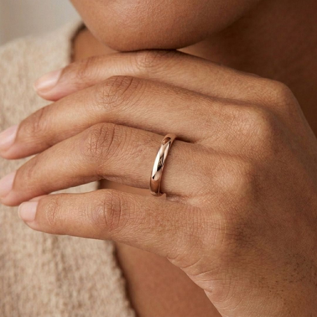 A model wearing the 3mm Slim Half Round Wedding Band in Rose Gold