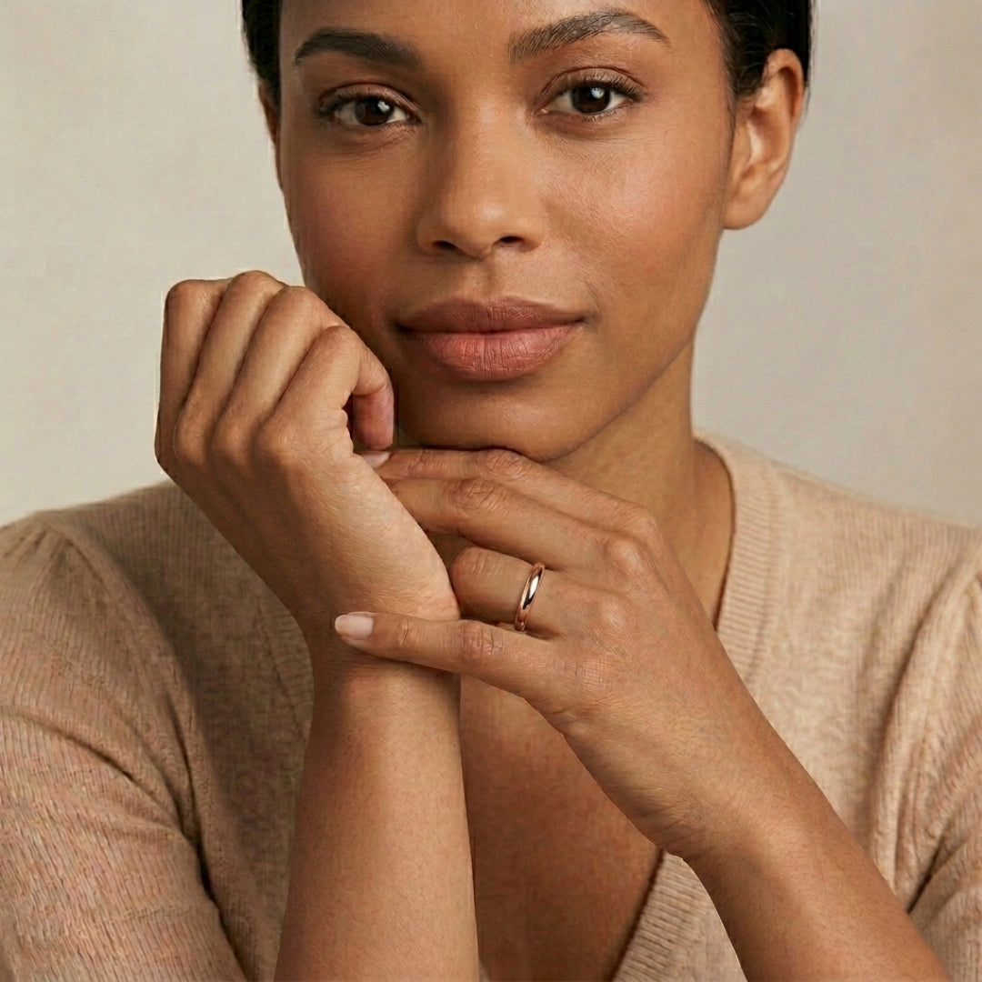 A model wearing the 3mm Slim Half Round Wedding Band in Rose Gold