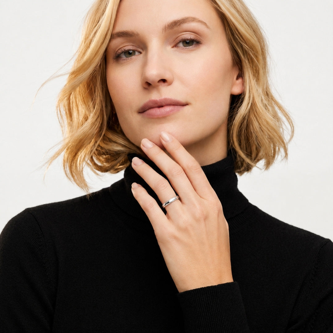 A model wearing the 3mm Sterling Silver Comfort Fit Milgrain Wedding Band