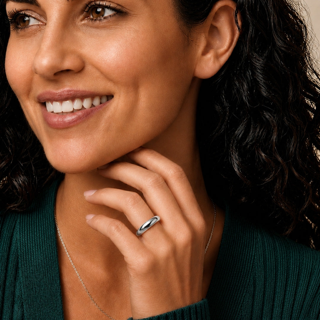 4mm sterling silver comfort fit wedding band worn on a model's hand, close-up view - AJ's Jewelry, Ridgewood NY