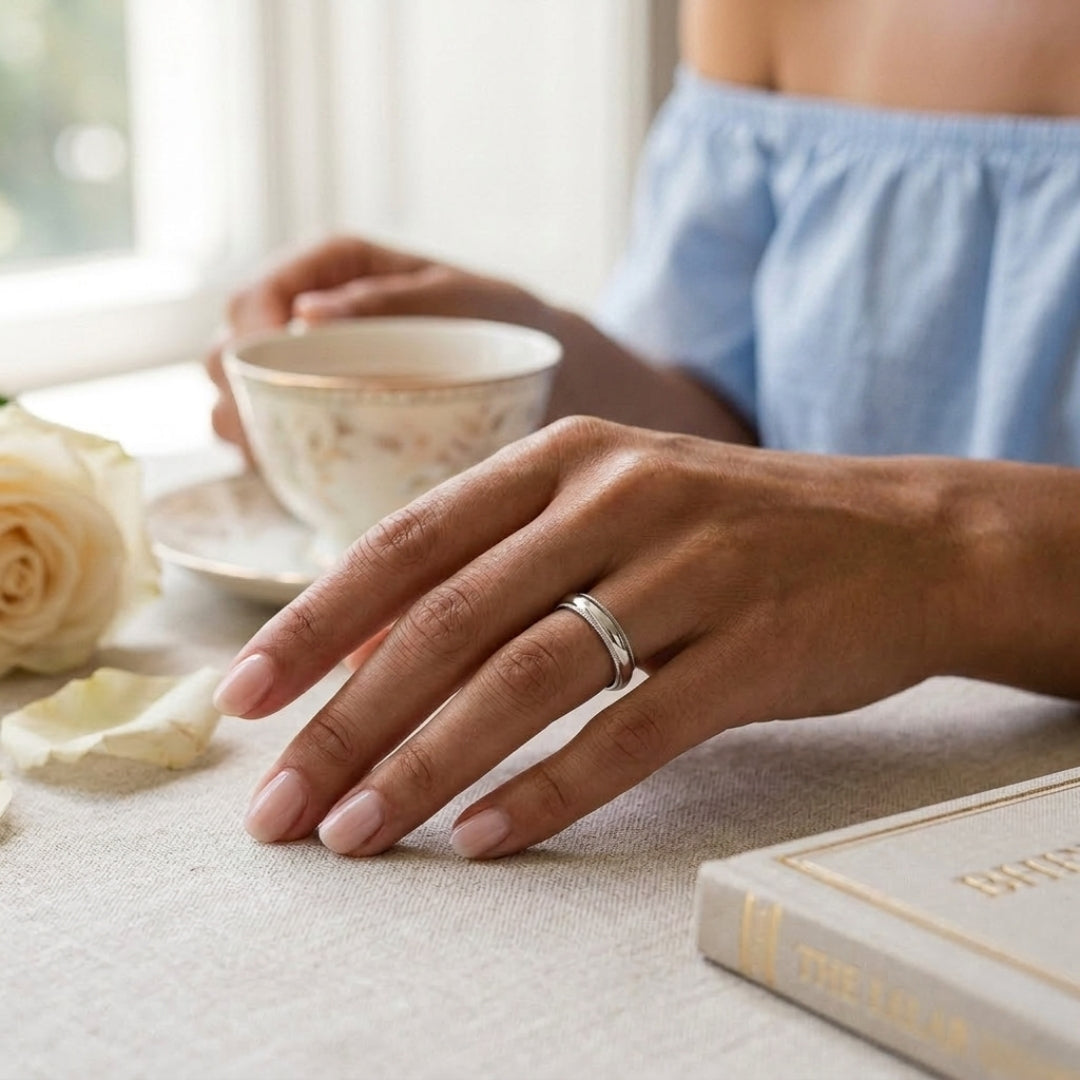 A model wearing the 4mm White Gold Comfort Fit Milgrain Wedding Band