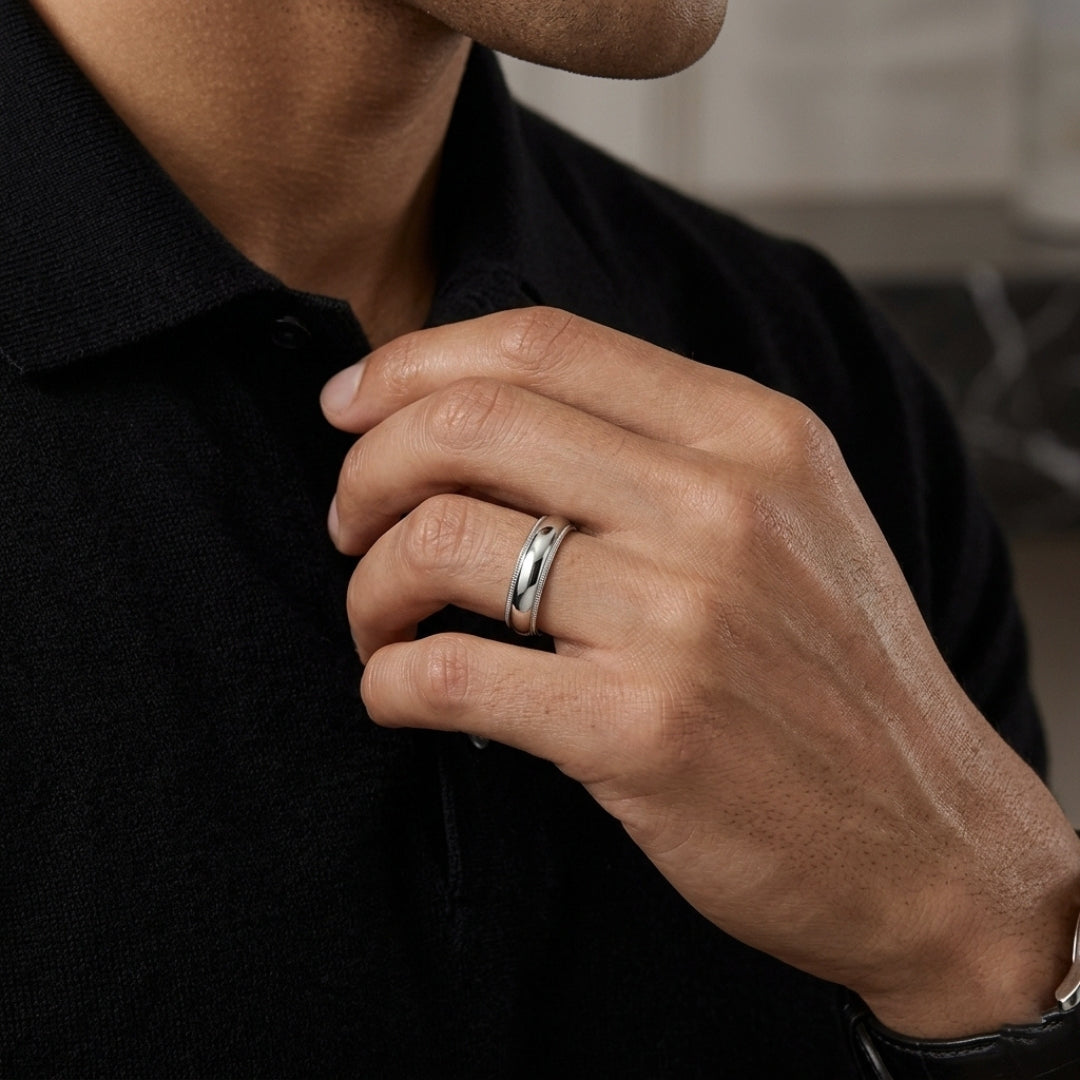 A model wearing the 5mm Sterling Silver Comfort Fit Milgrain Wedding Band