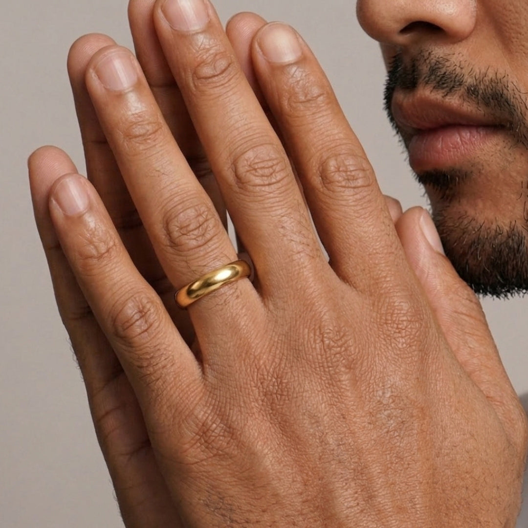 A model wearing the 5mm Slim Half Round Wedding Band in Yellow Gold