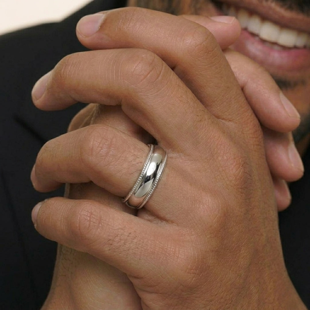 A model wearing the 6mm Sterling Silver Comfort Fit Milgrain Wedding Band