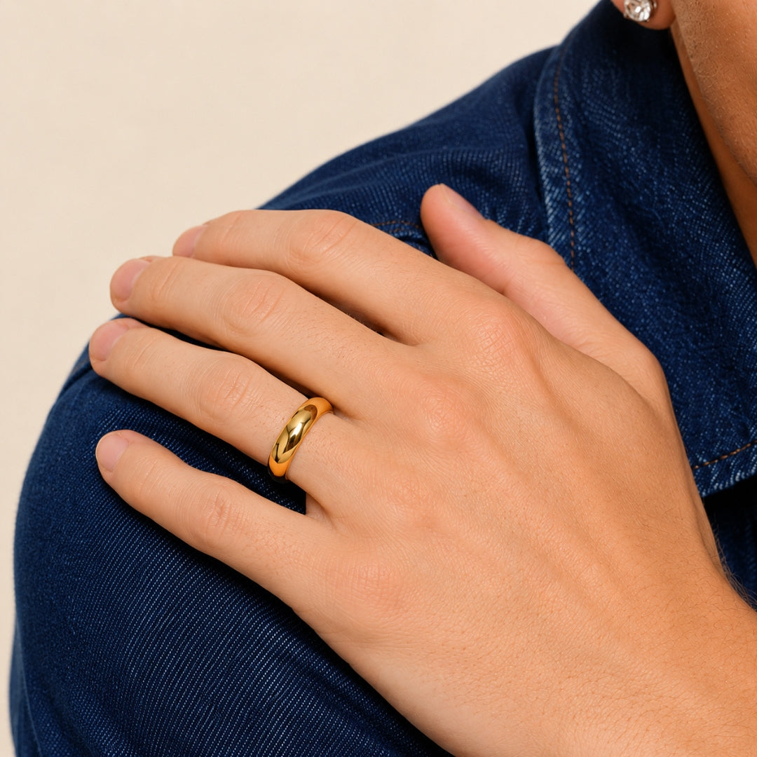 A model wearing the 6mm Slim Half Round Wedding Band in Yellow Gold