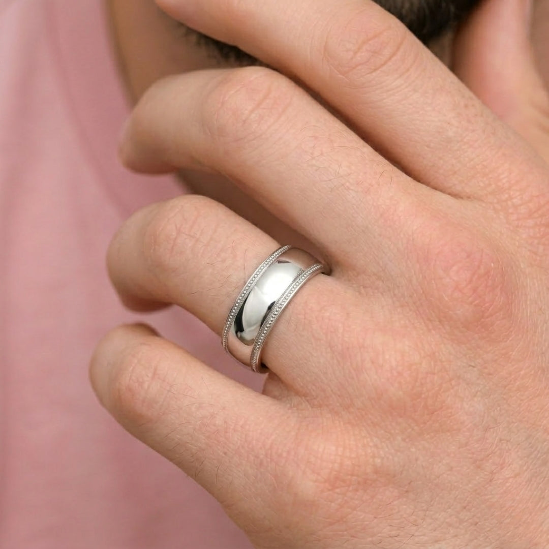 A model wearing the 7mm Sterling Silver Comfort Fit Milgrain Wedding Band