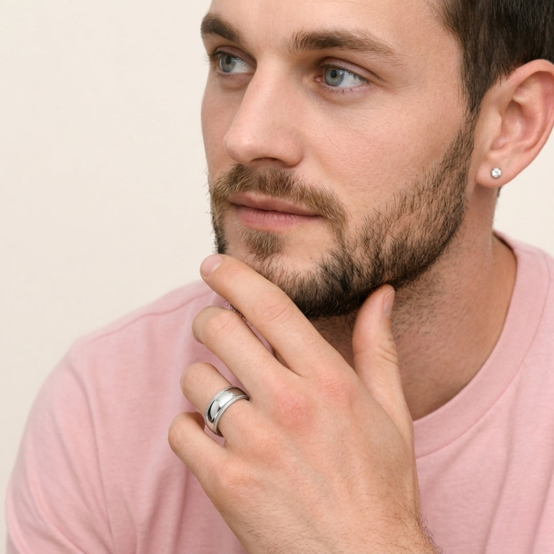 A model wearing the 7mm Sterling Silver Comfort Fit Milgrain Wedding Band