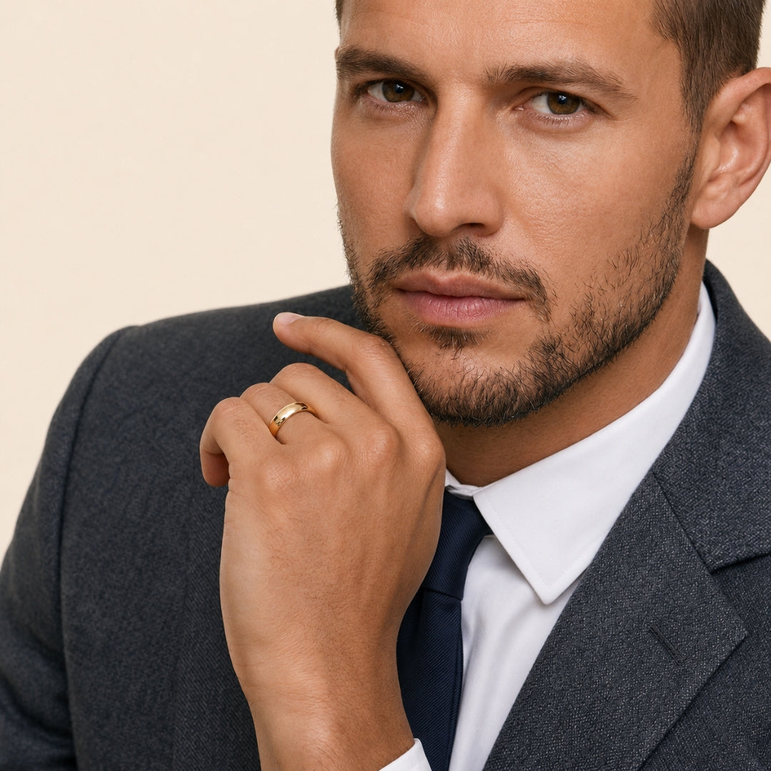 A model wearing the 7mm Slim Half Round Wedding Band in Yellow Gold