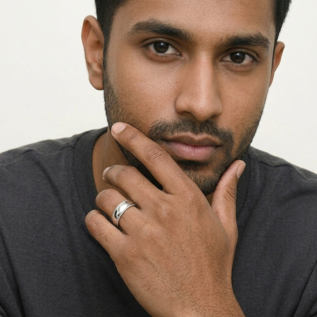 A model wearing the 8mm Sterling Silver Comfort Fit Milgrain Wedding Band