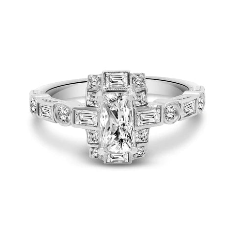 White gold diamond ring sitting on a white table