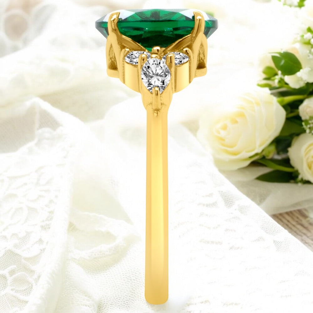 An image showing a side view of the finished Lab Grown Emerald engagement ring