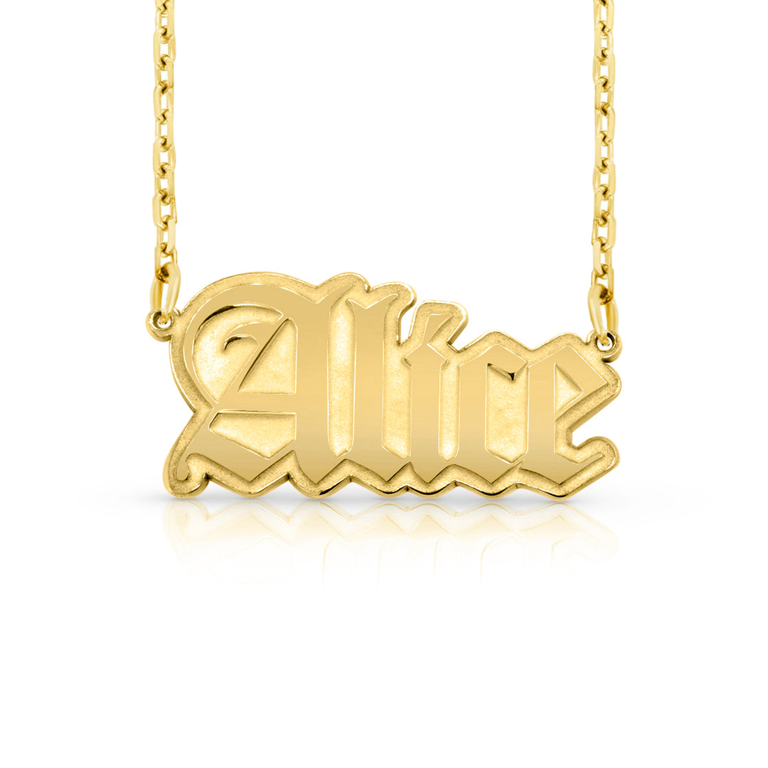 A gold nameplate necklace featuring the name 'Alice' in a stylized gothic font, suspended from a delicate gold chain against a clean white background.  This photo can change appearance depending on the name input using the custom name builder