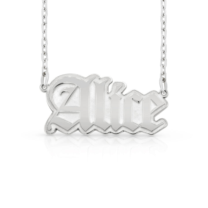 A silver nameplate necklace featuring the name 'Alice' in a stylized gothic font, suspended from a delicate silver chain against a clean white background.  This photo can change appearance depending on the name input using the custom name builder