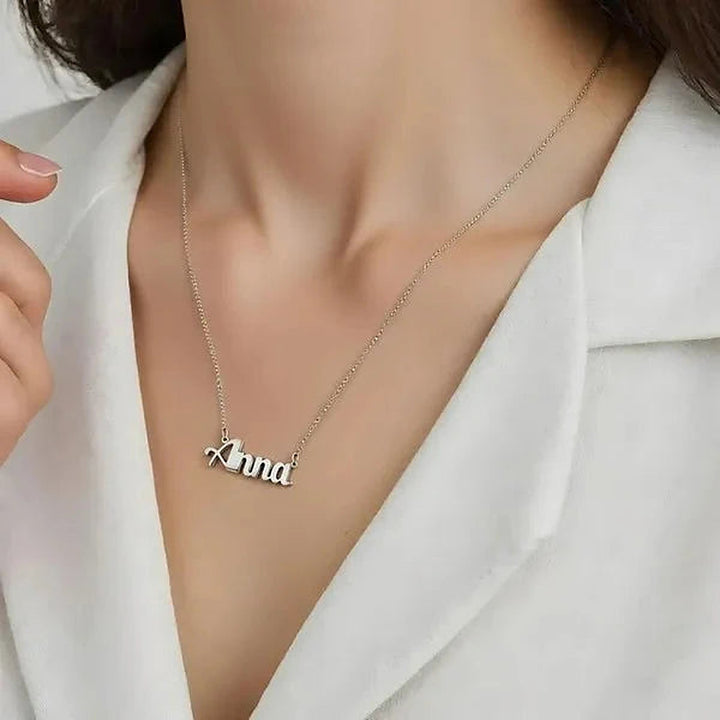 Model wearing the Sterling Silver Small Bold Print Name Necklace personalized with the name Anna | AJ's Jewelry