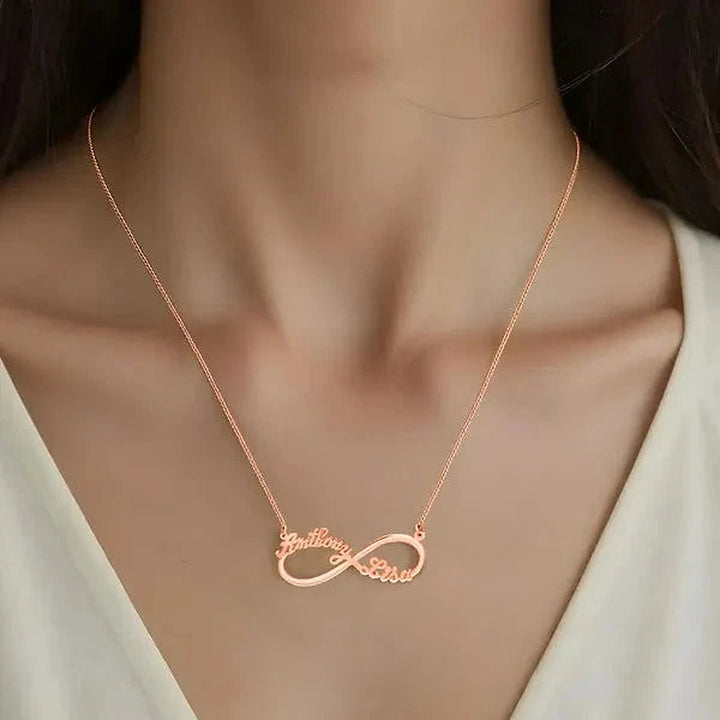 Model wearing the 14 Karat Two Name Infinity Name Necklace in 14K rose gold personalized with the name Anthony | AJ's Jewelry