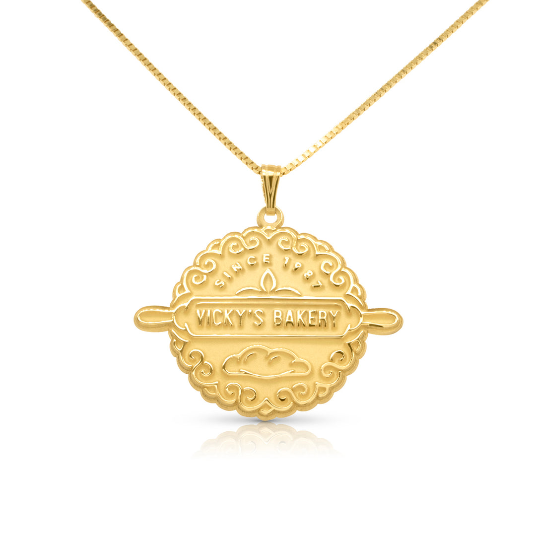 Completed 14kt yellow gold bakery logo pendant laser-engraved and hand-finished by AJ's Jewelry in Ridgewood Queens NY