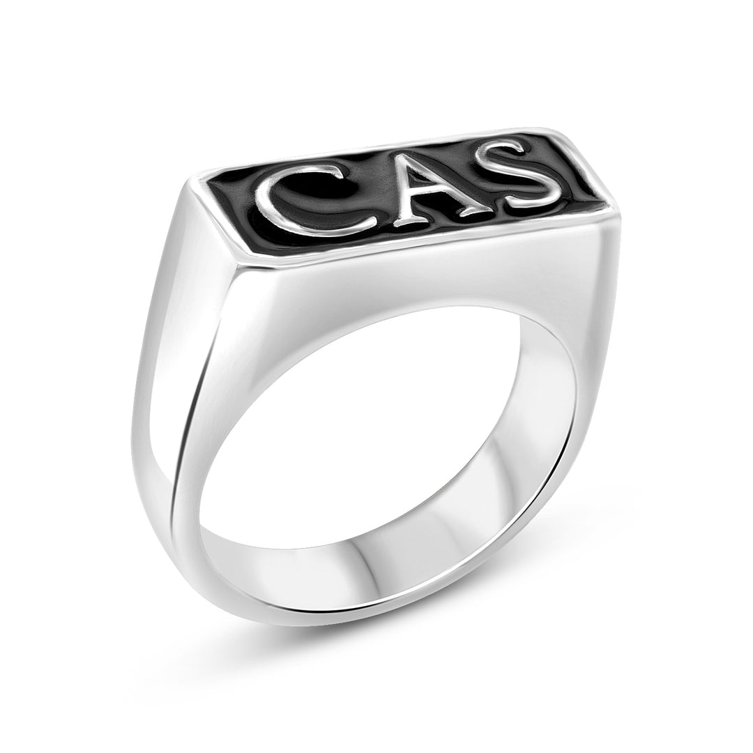 Finished sterling silver Cigarettes After Sex CAS signet ring with raised lettering and black enamel, angled view — AJ's Jewelry Queens NY