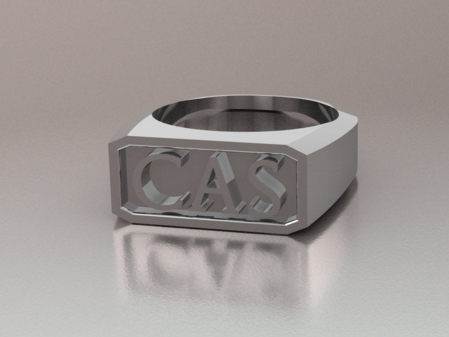 Angled CAD render of the CAS signet ring showing the client's chosen font for the raised initials — AJ's Jewelry Queens NY