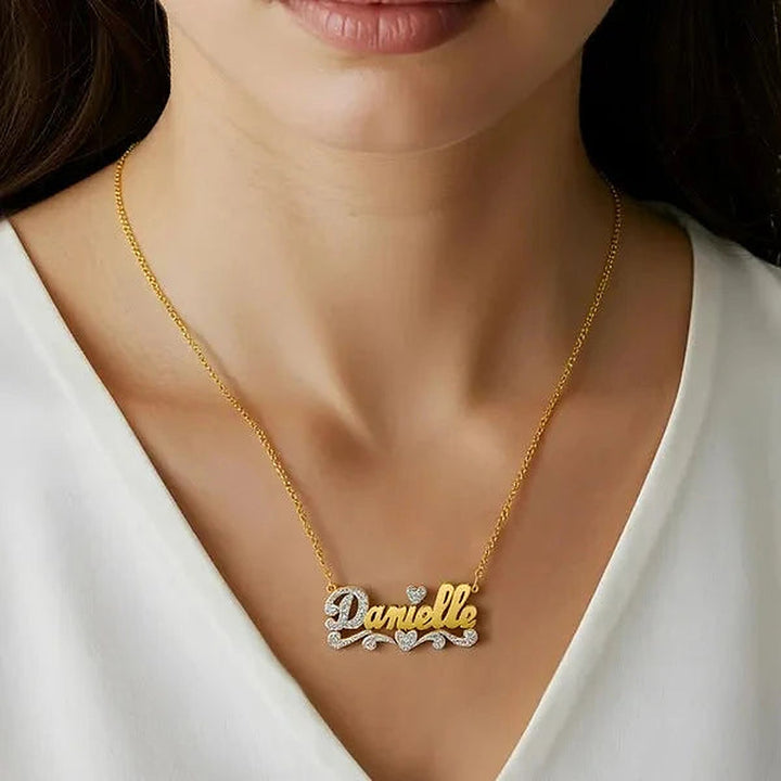 Model wearing the 14 Karat Polished and Diamond Cut 3D Name Necklace in 14K yellow gold, name Danielle | AJ's Jewelry