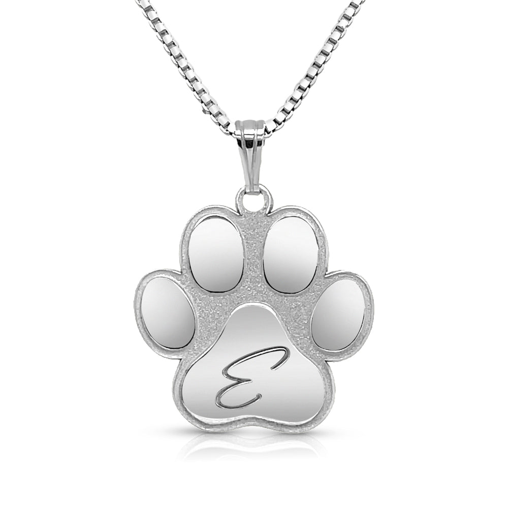 Completed sterling silver personalized dog paw print pendant with an engraved initial, laser-cut and hand-finished by AJ's Jewelry in Ridgewood Queens NY