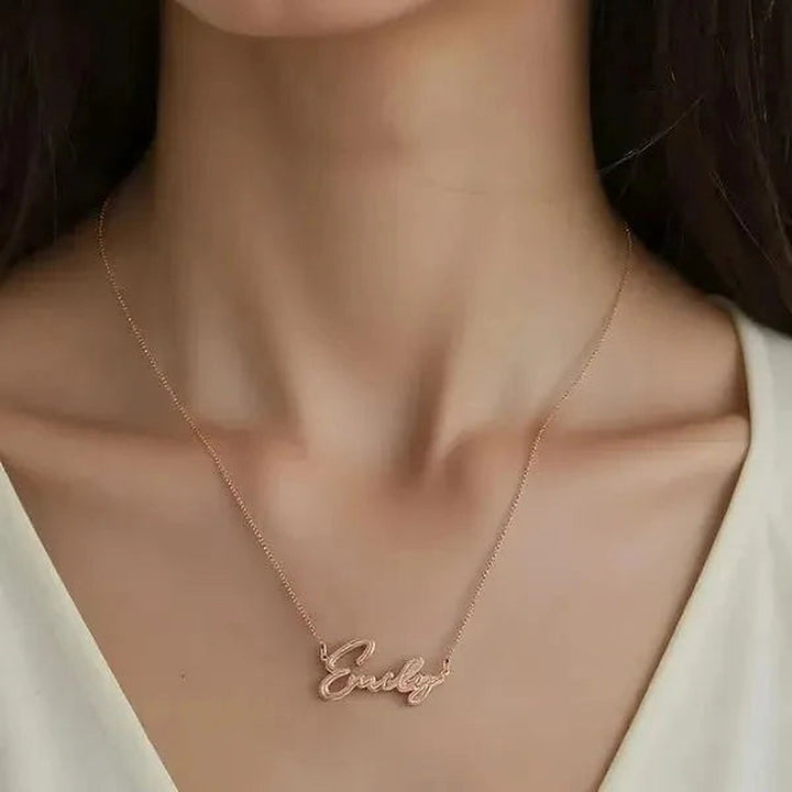 Model wearing the 14 Karat Thin Script Name Necklace in 14K rose gold personalized with the name Emily | AJ's Jewelry