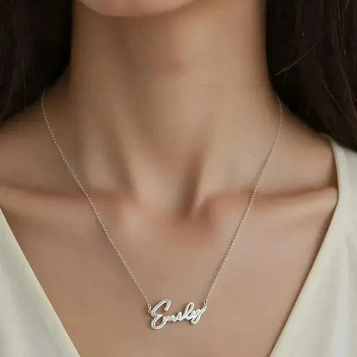 Model wearing the 14 Karat Thin Script Name Necklace in 14K white gold personalized with the name Emily | AJ's Jewelry