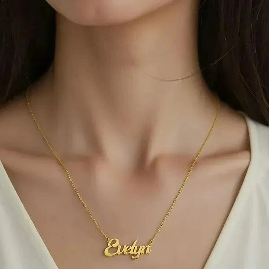 Model wearing the 14 Karat Solid Letter Name Necklace in 14K yellow gold personalized with the name Evelyn | AJ's Jewelry