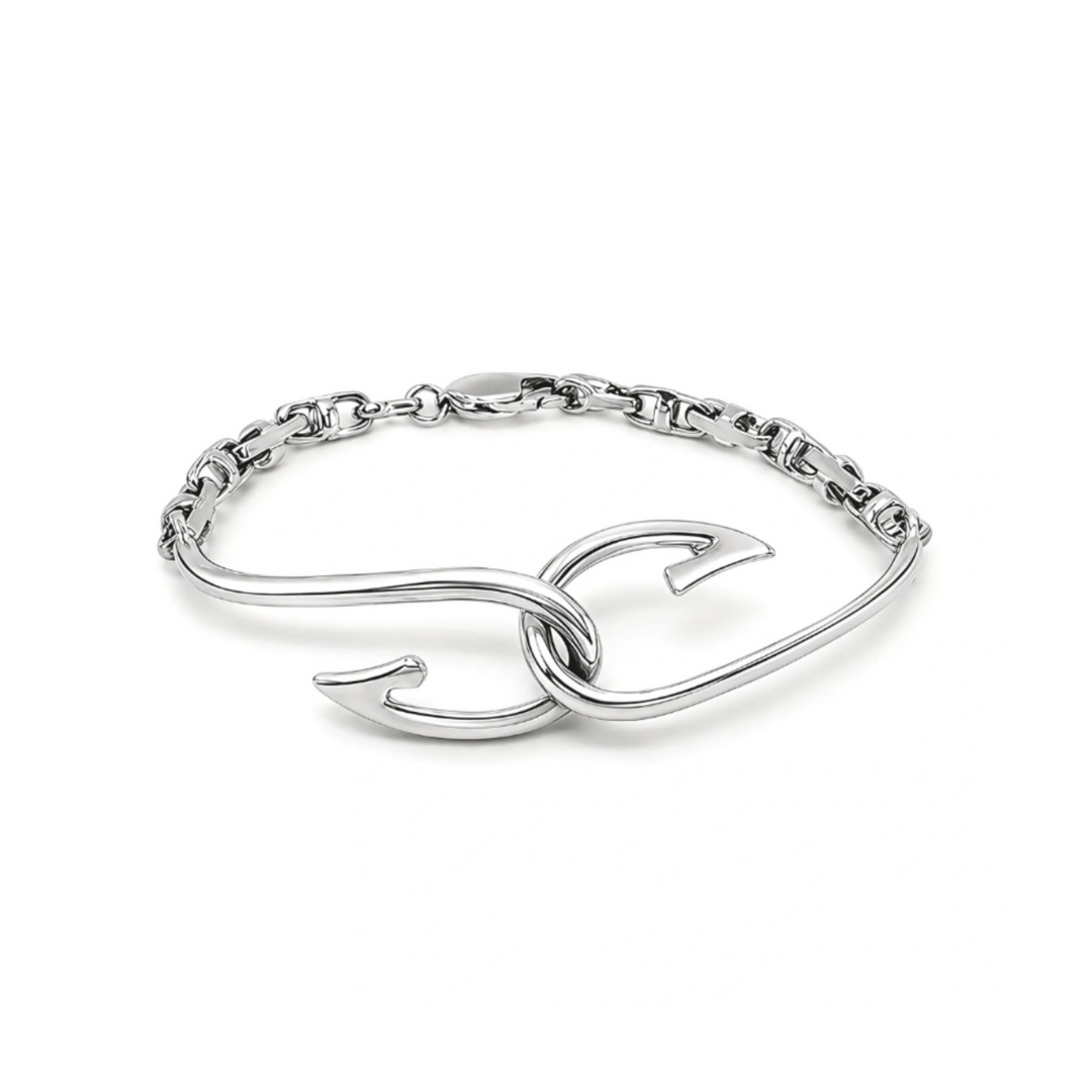 A white gold bracelet featuring a large interlocking hook design, displayed on a clean white background.